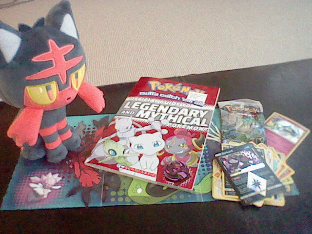 the exceptions, a litten plush, a legendary and mythical pokemon guidebook plus poster,
  and a sun and moon ultra prism booster pack plus palkia coin and kirlia card.